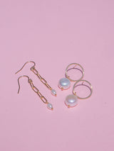 White freshwater pearls freely hang from gold-filled circle stud and chain earrings. Also available in sterling silver.