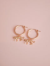 These simple and elegant gold-filled hoop earrings will add a stylish and unique touch to your look. Adorned with 14k gold plated leopard charms, they are the perfect statement earrings to add a subtle pop of personality to any outfit.