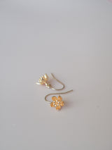 A bundle of quality gold-filled earrings featuring gemstones, hearts, stars, suns and lotus flowers.