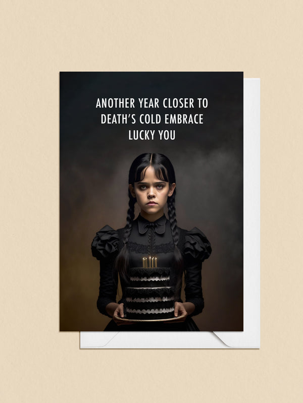 Break the expectations of conventional birthday cards with Wednesday Addams' themed humour! This card is sure to bring dark delight to your loved one's special day. Make sure they know you care in a creepy kinda way.    10.5 x 14.8 cm (A6) Heavyweight 16pt paper stock Sustainably sourced paper Light satin finish, left uncoated on the inside for easier writing Envelope included  Dead inside - I mean blank inside